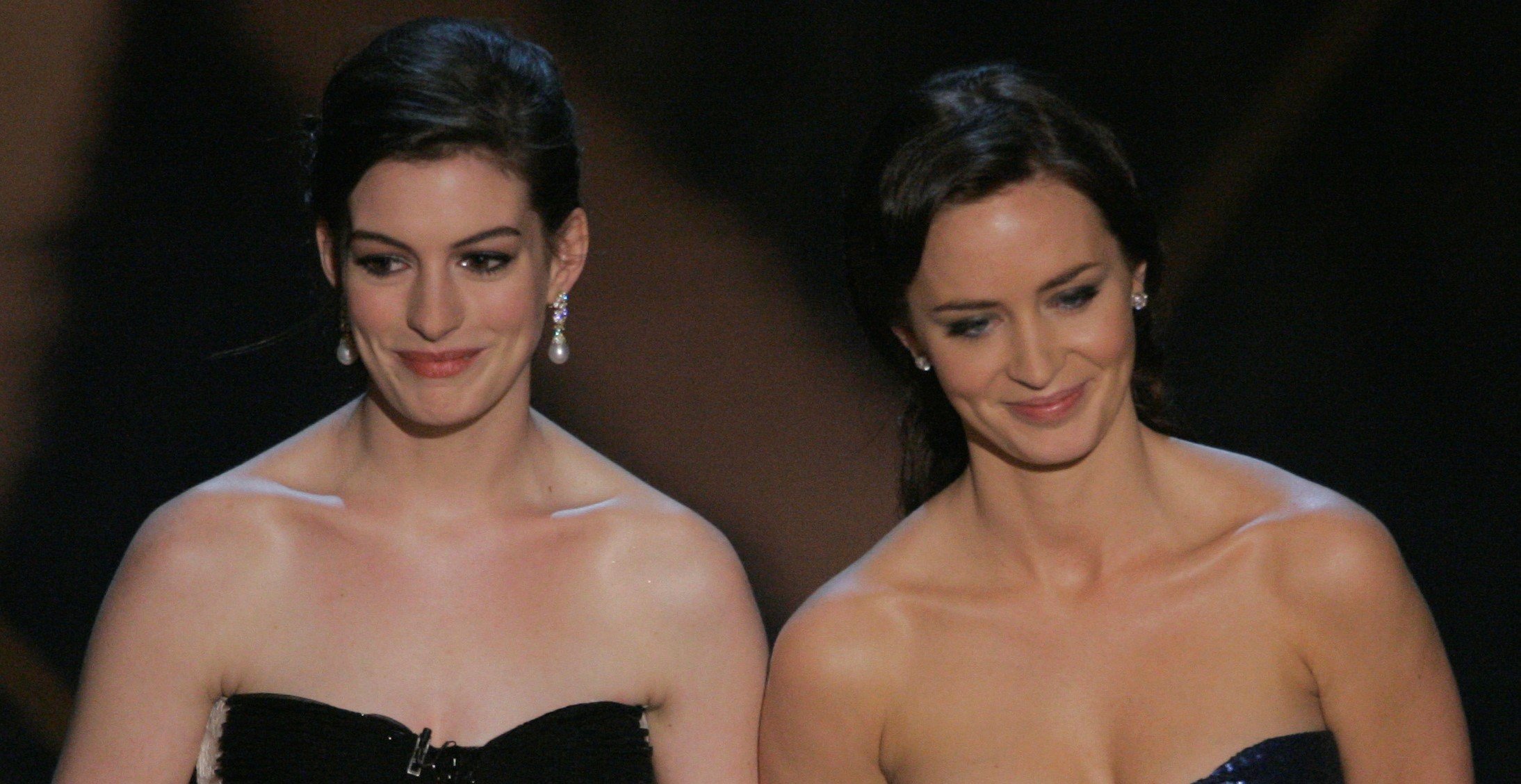 Presenters Anne Hathaway, left, and Emily Blunt, are seen at the 79th Acade...